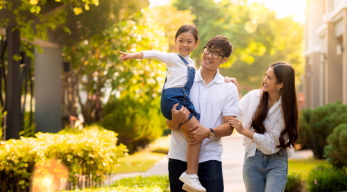 This image: A family enjoying a walk along a pavement with trees.
							 	The map:  A zoomed in shot of the site and the local area.